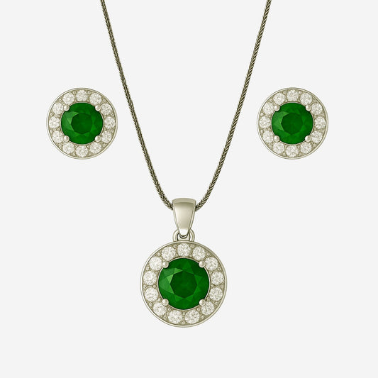 Jewelry set with green gemstone pendant and earrings on white background