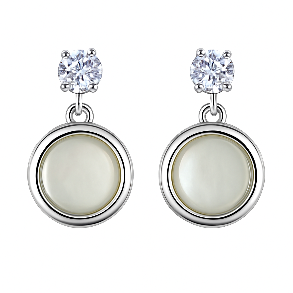 A pair of silver-tone drop earrings featuring a cubic zirconia stud on top and a mother of pearl inlay in a circular design.