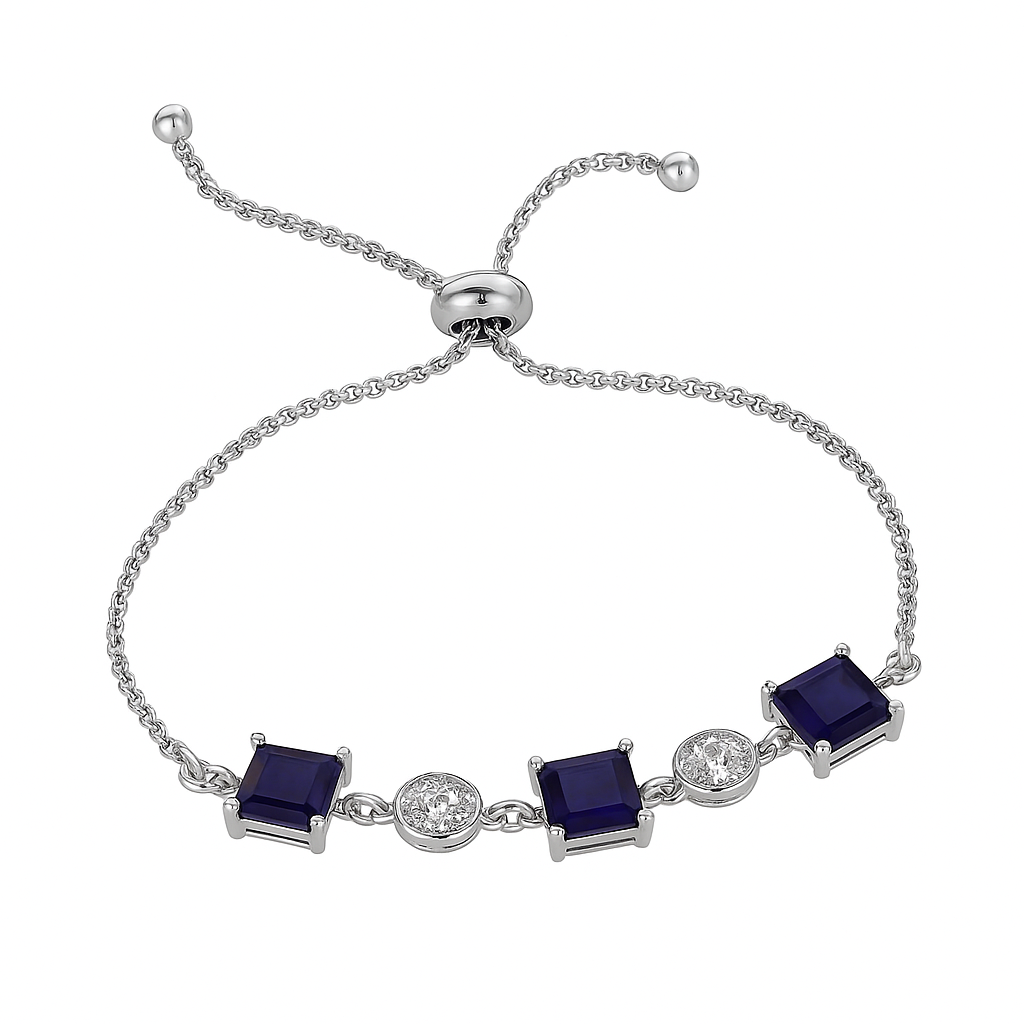 Silver bracelet with blue square stones and clear gemstones on a white background