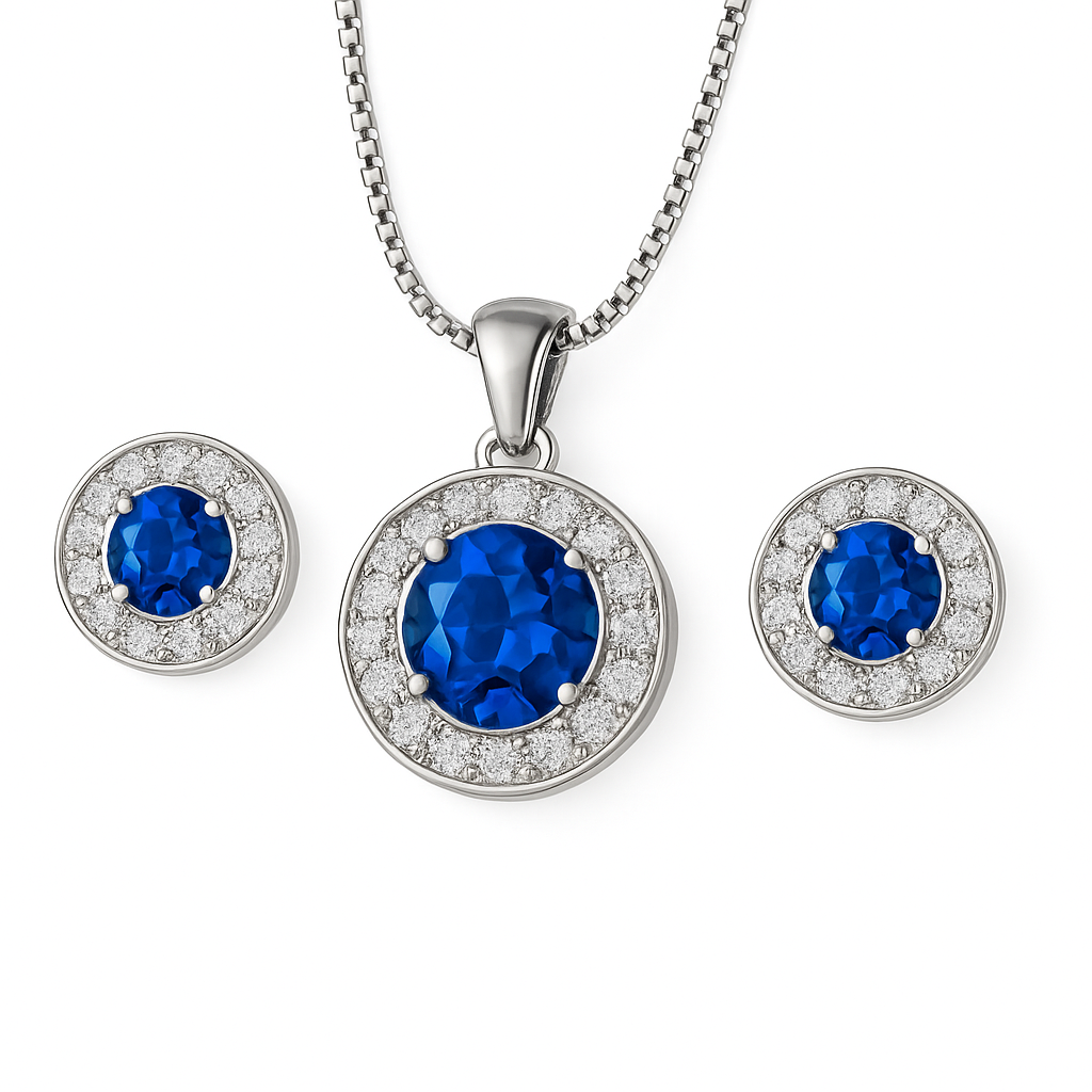Silver jewelry set with blue gemstones and diamond accents on a white background.
