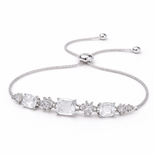 Silver bracelet with clear gemstones on a white background