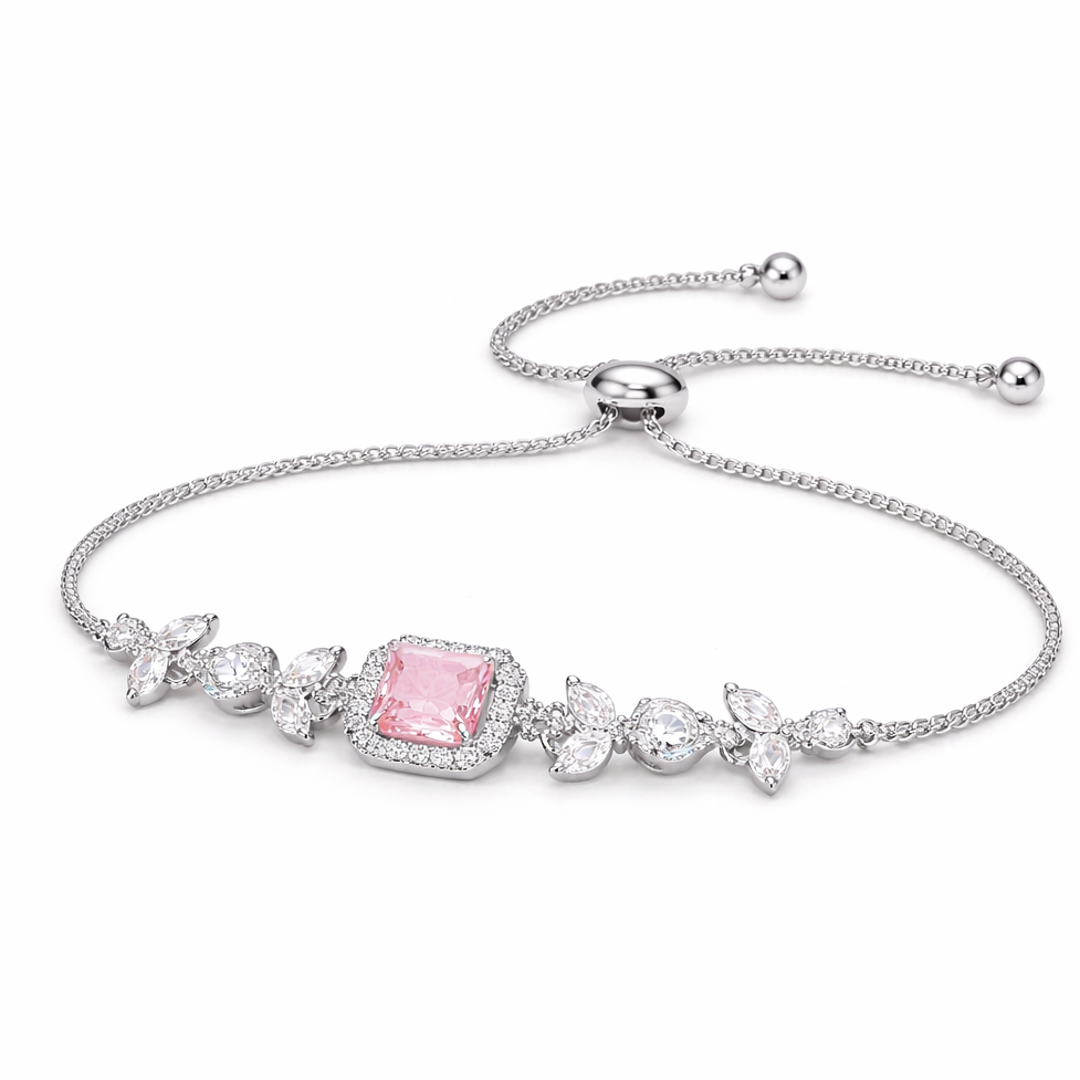 Silver bracelet with a pink gemstone on a white background