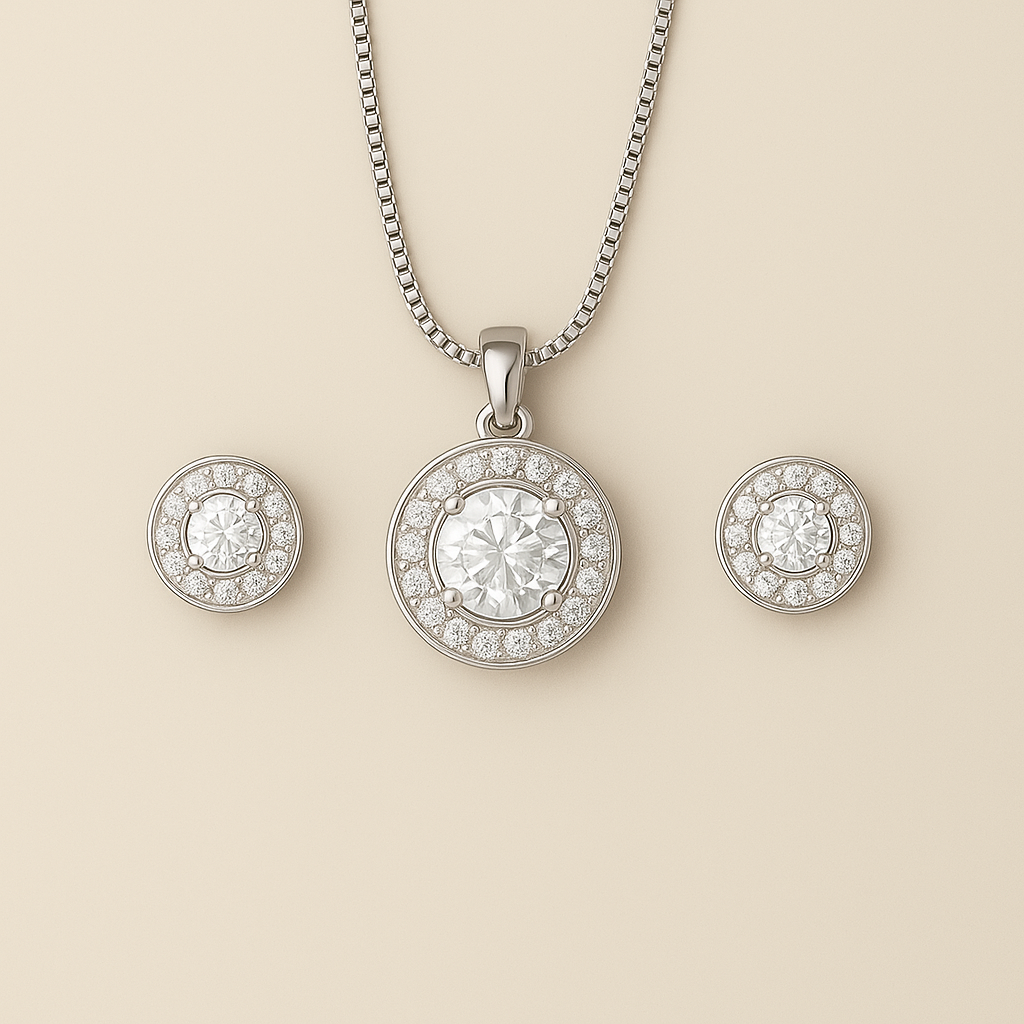 Silver necklace and earrings on a beige background