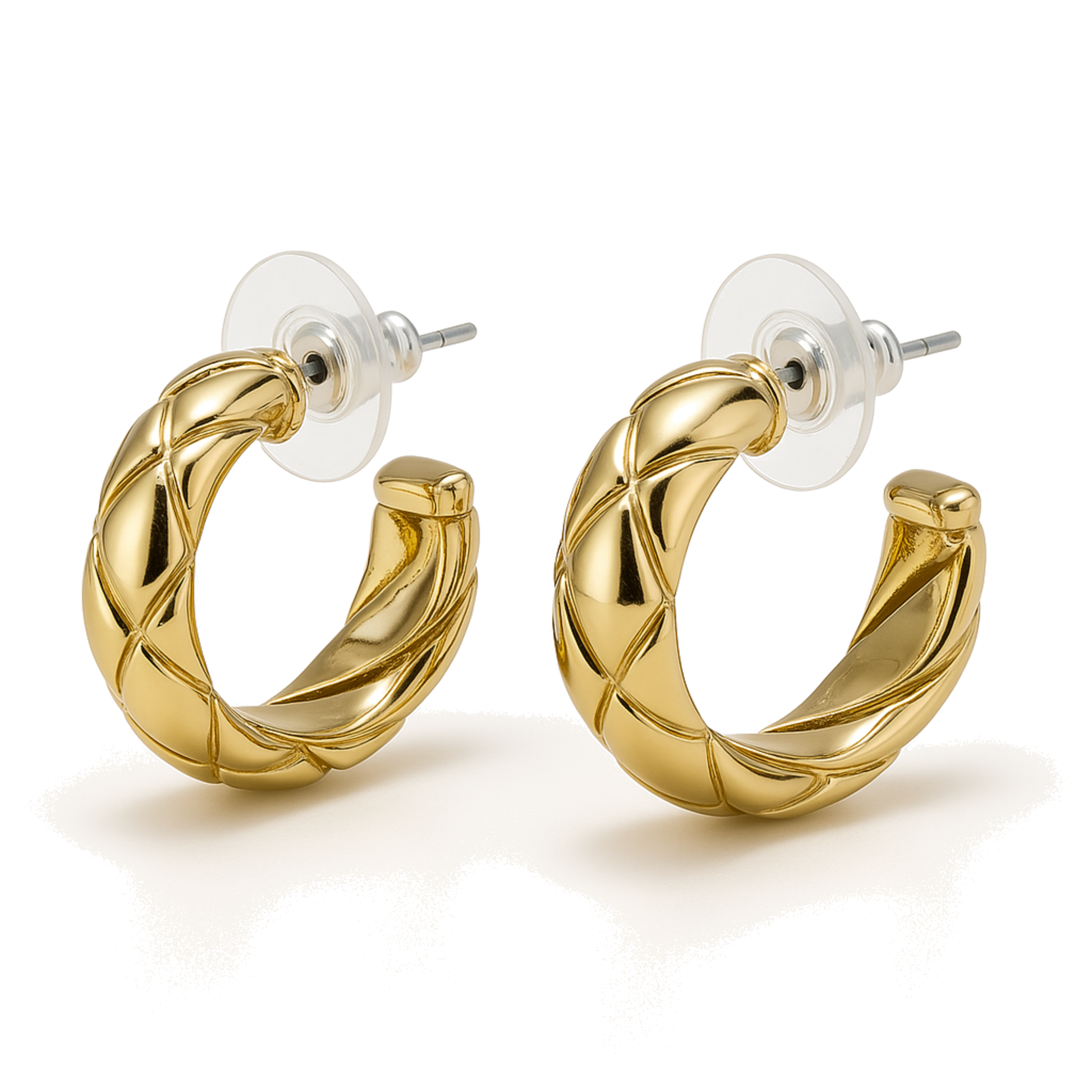 Gold hoop earrings on a white background